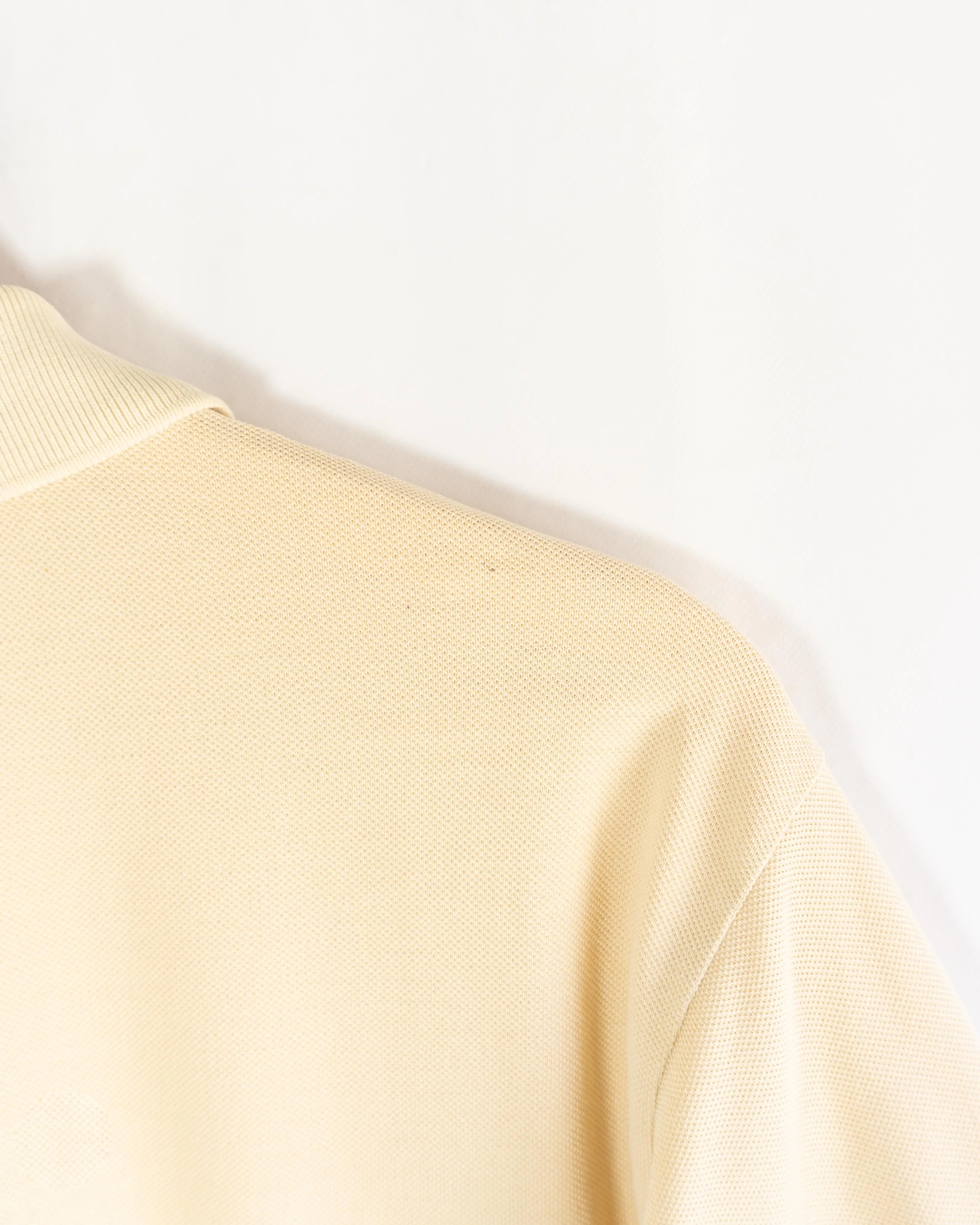 Polo Lacoste Vintage Color Crema — Talla M